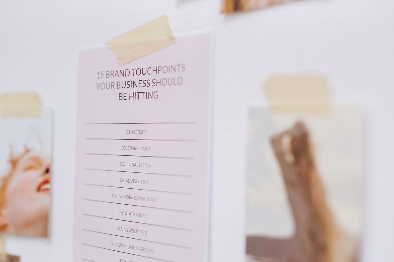 Close-up of a wall displaying a list of brand touchpoints for businesses.